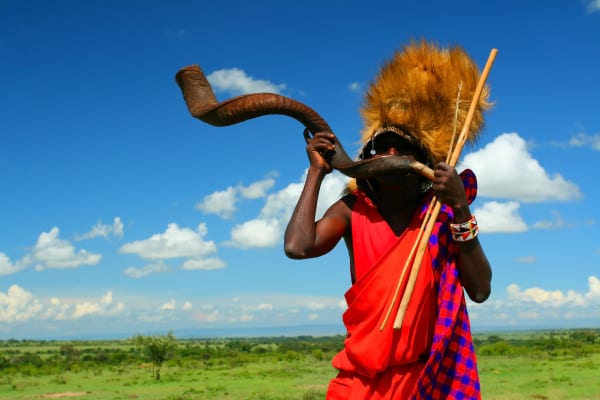 Masai-warrior-playing-traditional-horn.-